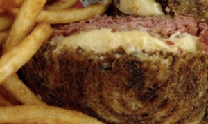 A reuben with fries