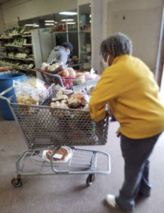 A woman pushes a cart