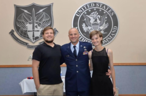 Three people pose