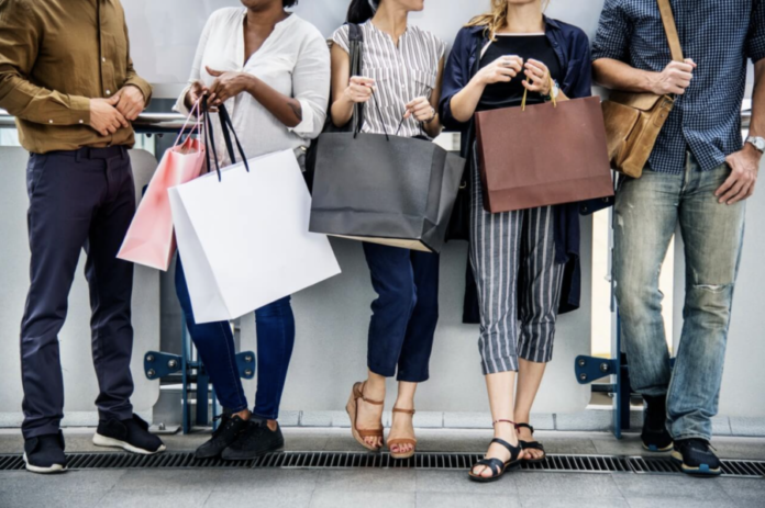 people holding shopping bags