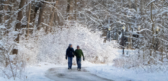 people hike snowy path