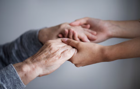 caregiver holding hands